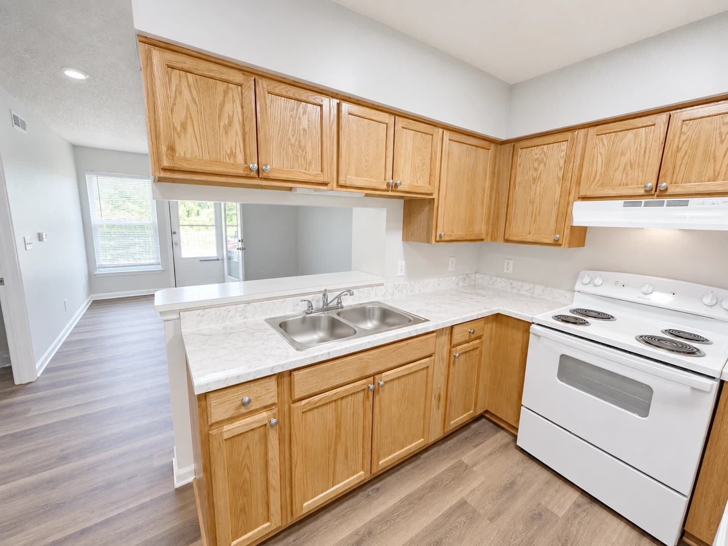 Commercial kitchen with newly installed cabinets and flooring